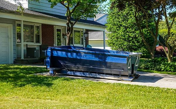 residential dumpsters can be placed on a driveway or lawn, but safety measures should be required to avoid damage to the property